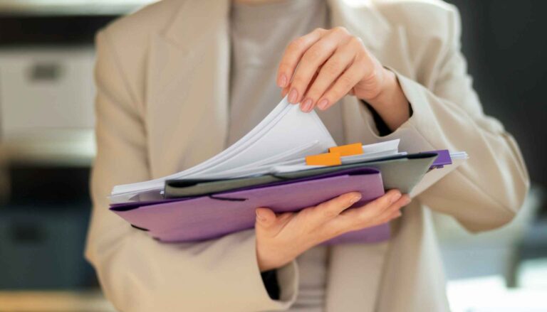 A quality management staff is checking the documents