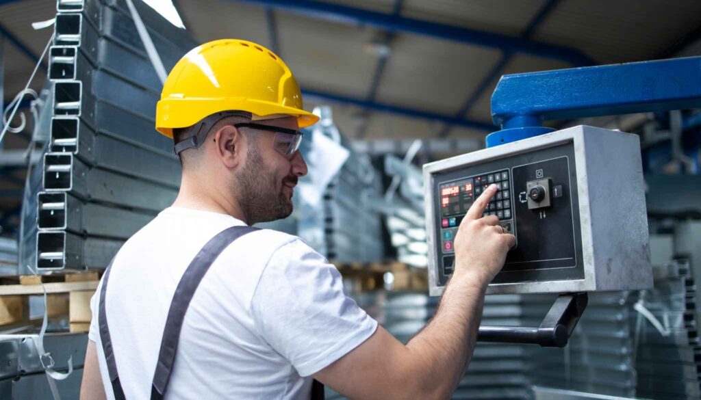 A person is calibrating a machine in factory